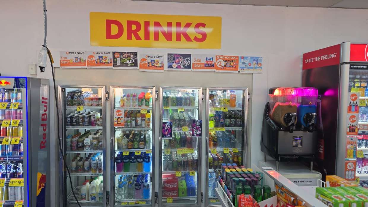 Drinks wall with fridges full of cold beverages