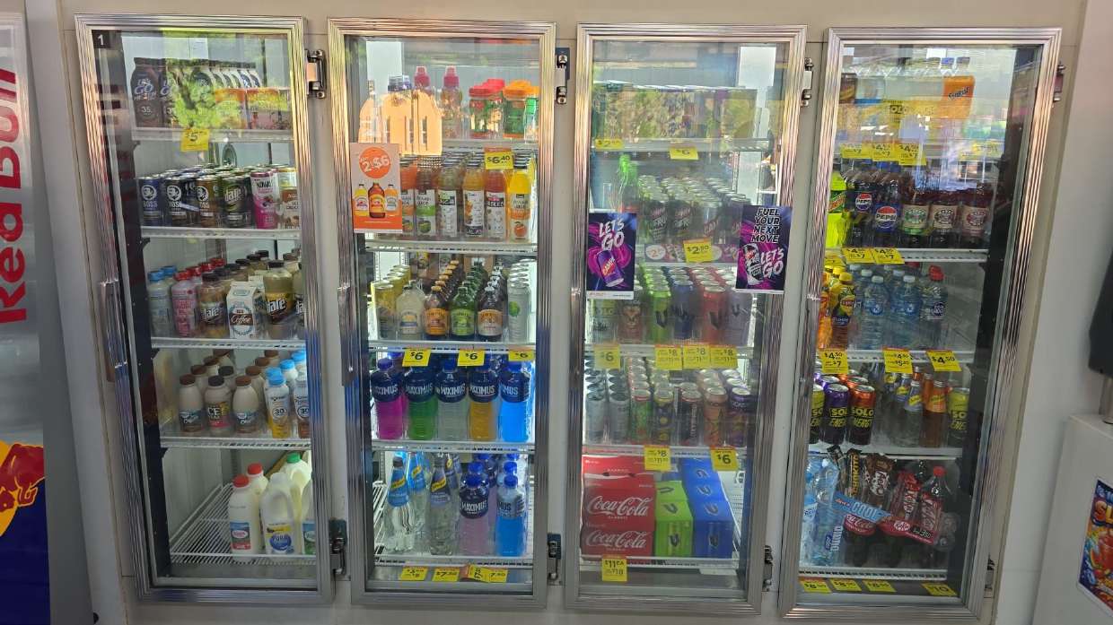 Glass door coolers stocked with cold drinks