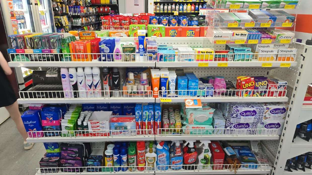 Wide view of stocked shelves inside the store
